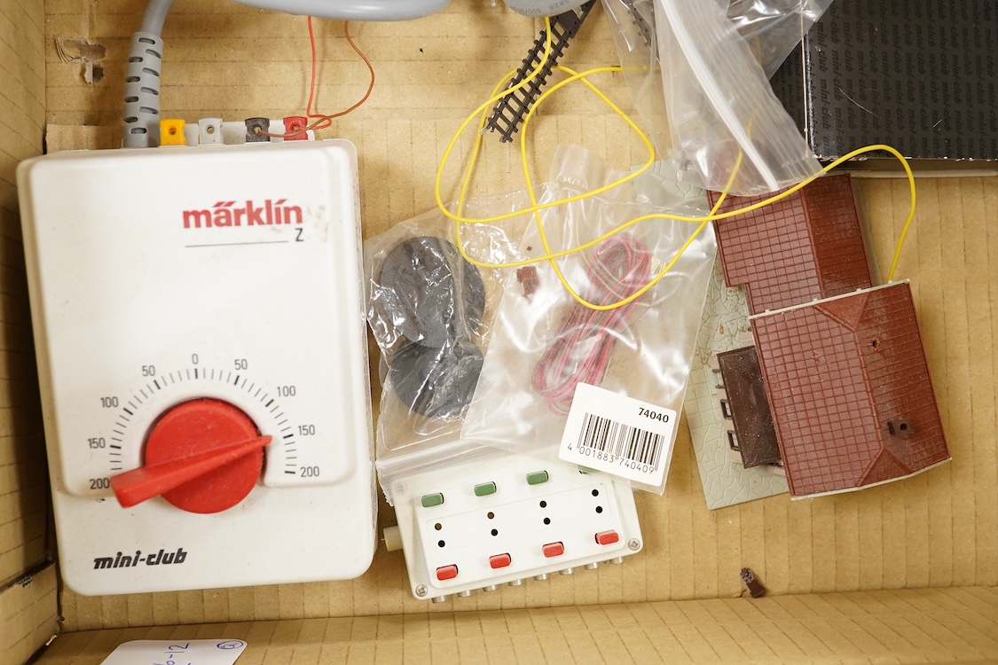 A Marklin Z gauge railway collection, Swiss railway from set 81852, including an SBB CFF FFS Bo-Bo pantograph electric locomotive, together with a boxed Mini-club unpowered 4-car set (87456), three freight wagons, a brid